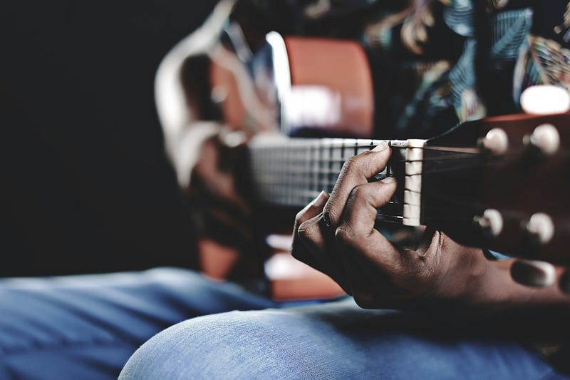 A man playing a guitar